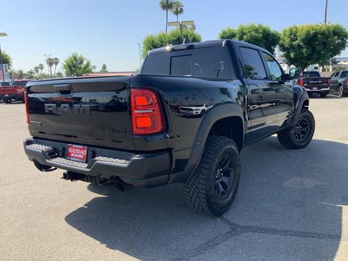 Diamond Black Crystal Pearlcoat 2026 RAM 1500 RHO Crew Cab 4x4 5'7' Box