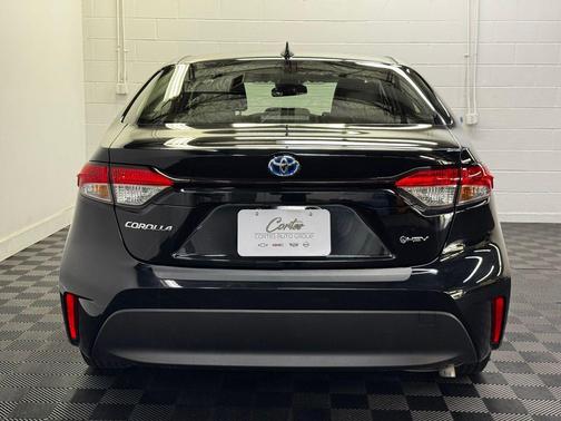 Midnight Black Metallic 2025 Toyota Corolla Hybrid LE