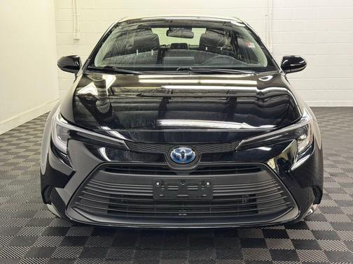 Midnight Black Metallic 2025 Toyota Corolla Hybrid LE