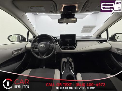 White 2023 Toyota Corolla Hybrid LE