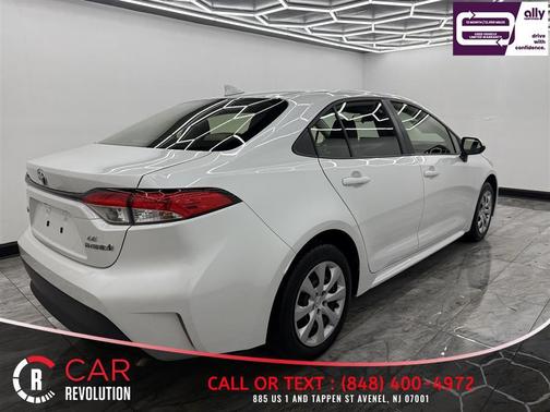 White 2023 Toyota Corolla Hybrid LE