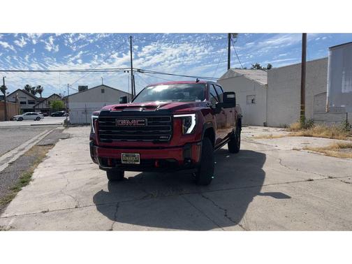 Volcanic Red Tintcoat 2026 GMC Sierra 2500 AT4