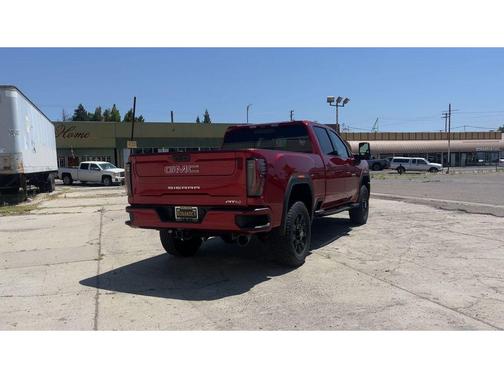 Volcanic Red Tintcoat 2026 GMC Sierra 2500 AT4