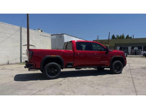 Volcanic Red Tintcoat 2026 GMC Sierra 2500 AT4