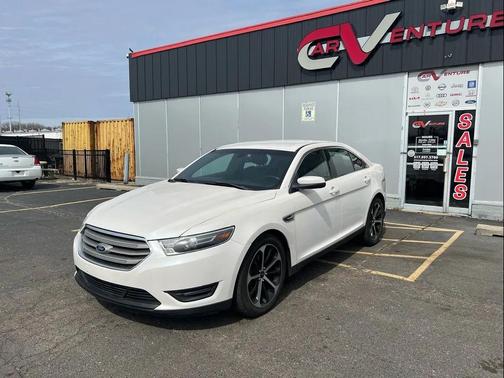 White 2016 Ford Taurus SEL