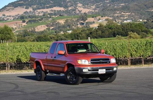 Orange 2002 Toyota Tundra Limited Access Cab