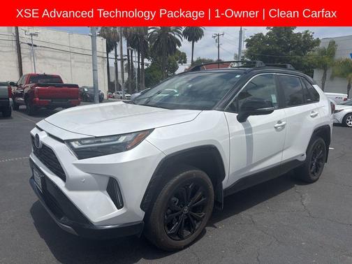 Wind Chill Pearl/Midnight Black Metallic 2023 Toyota RAV4 Hybrid SE