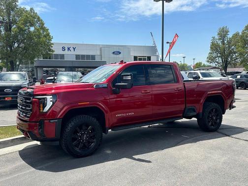 Volcanic Red Tintcoat 2025 GMC Sierra 2500 AT4
