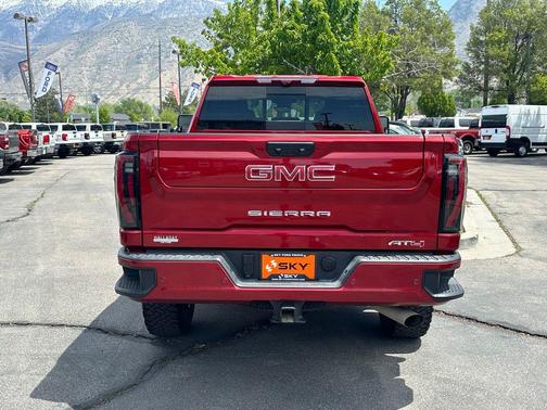 Volcanic Red Tintcoat 2025 GMC Sierra 2500 AT4