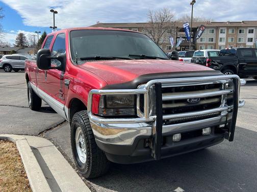 Red 2002 Ford F-250 Lariat