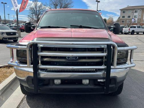 Red 2002 Ford F-250 Lariat