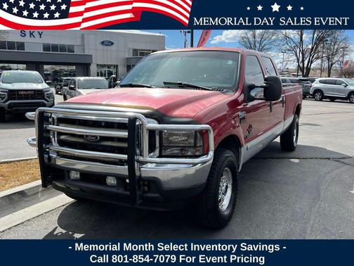 Red 2002 Ford F-250 Lariat