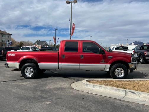 Red 2002 Ford F-250 Lariat
