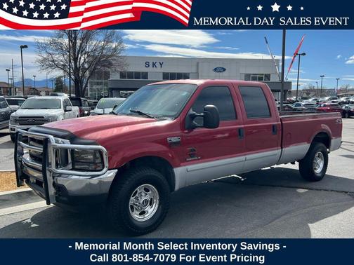 Red 2002 Ford F-250 Lariat