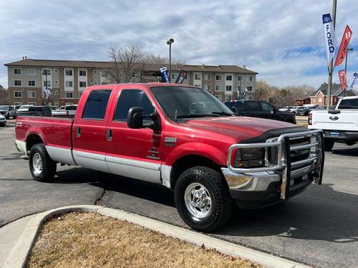 Red 2002 Ford F-250 Lariat
