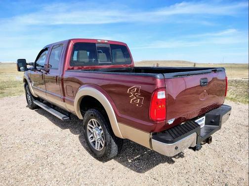Red 2012 Ford F-250 Lariat