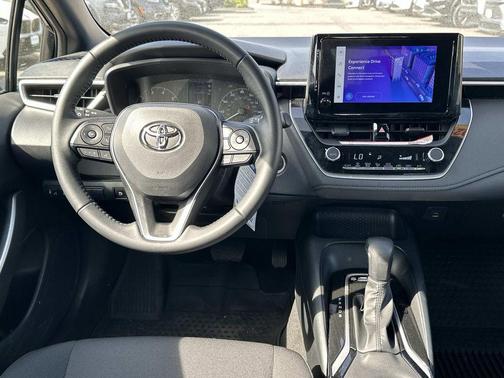 Midnight Black Metallic 2025 Toyota Corolla Hybrid SE