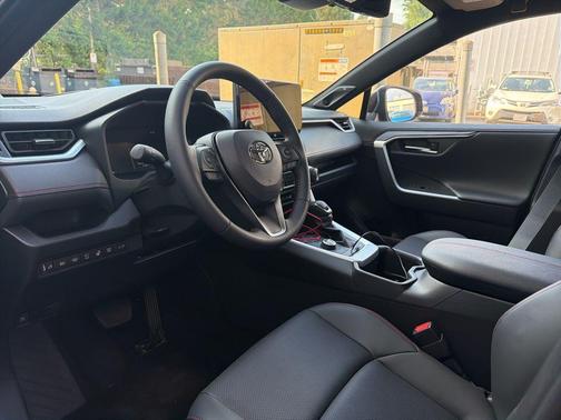Supersonic Red/Midnight Black Metallic 2025 Toyota RAV4 Hybrid SE