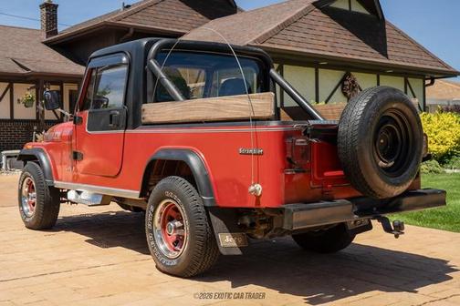 Red 1985 Jeep Scrambler