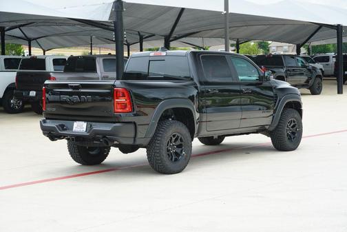 Diamond Black Crystal Pearlcoat 2026 RAM 1500 RHO Crew Cab 4x4 5'7' Box
