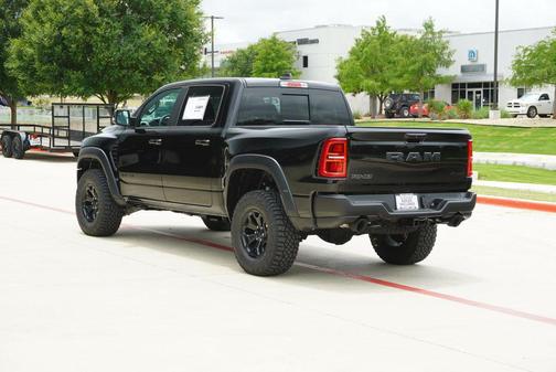 Diamond Black Crystal Pearlcoat 2026 RAM 1500 RHO Crew Cab 4x4 5'7' Box