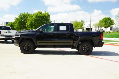 Diamond Black Crystal Pearlcoat 2026 RAM 1500 RHO Crew Cab 4x4 5'7' Box