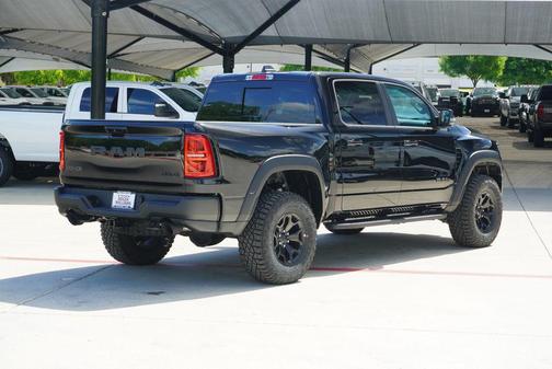 Diamond Black Crystal Pearlcoat 2026 RAM 1500 RHO Crew Cab 4x4 5'7' Box