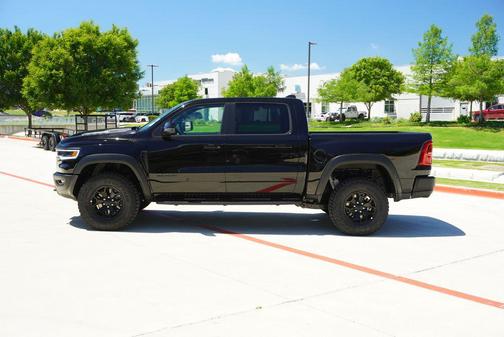 Diamond Black Crystal Pearlcoat 2026 RAM 1500 RHO Crew Cab 4x4 5'7' Box