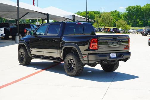 Diamond Black Crystal Pearlcoat 2026 RAM 1500 RHO Crew Cab 4x4 5'7' Box