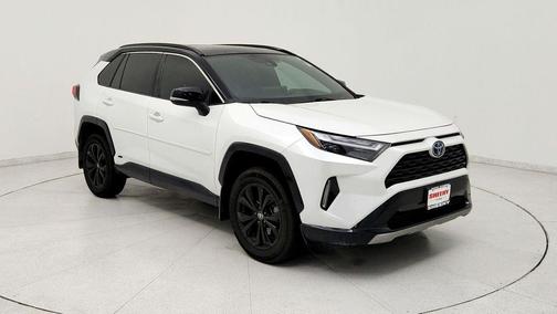 Wind Chill Pearl/Midnight Black Metallic 2024 Toyota RAV4 Hybrid SE