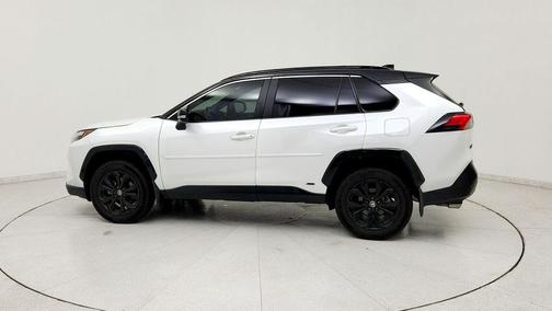 Wind Chill Pearl/Midnight Black Metallic 2024 Toyota RAV4 Hybrid SE