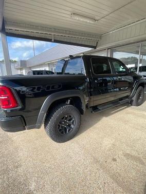 Diamond Black Crystal Pearlcoat 2026 RAM 1500 RHO Crew Cab 4x4 5'7' Box