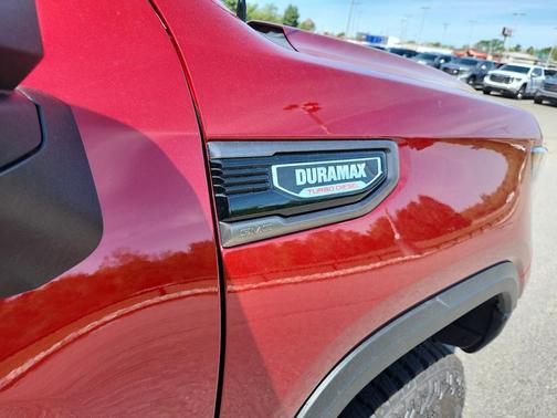Volcanic Red Tintcoat 2026 GMC Sierra 1500 AT4X
