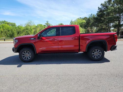 Volcanic Red Tintcoat 2026 GMC Sierra 1500 AT4X
