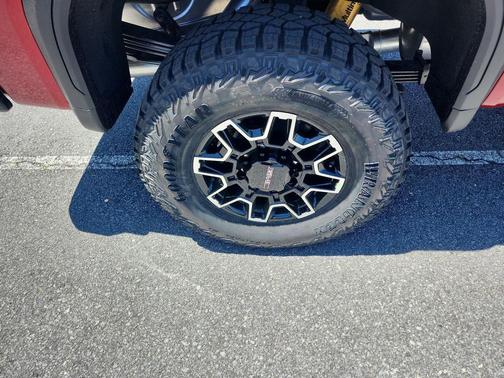 Volcanic Red Tintcoat 2026 GMC Sierra 2500 AT4X