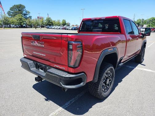 Volcanic Red Tintcoat 2026 GMC Sierra 2500 AT4X