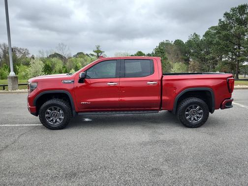 Volcanic Red Tintcoat 2024 GMC Sierra 1500 AT4