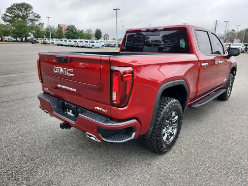 Volcanic Red Tintcoat 2024 GMC Sierra 1500 AT4
