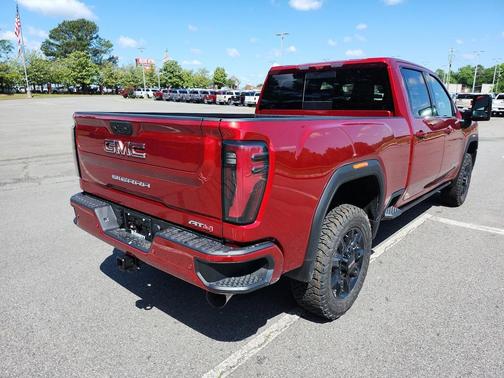 Volcanic Red Tintcoat 2026 GMC Sierra 2500 AT4