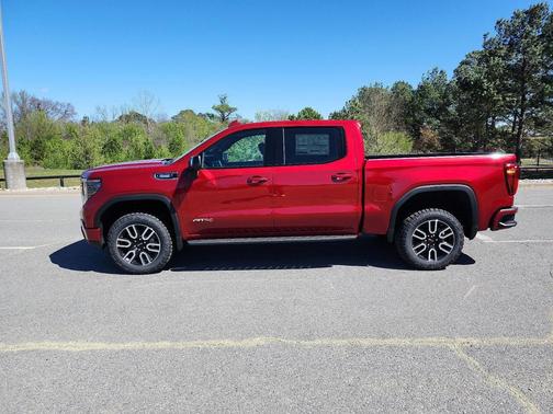 Volcanic Red Tintcoat 2026 GMC Sierra 1500 AT4