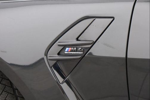 Black Sapphire Metallic 2024 BMW M4 Competition xDrive