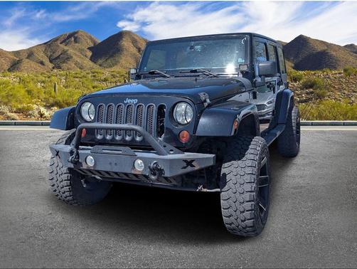 Black 2013 Jeep Wrangler Unlimited Sahara