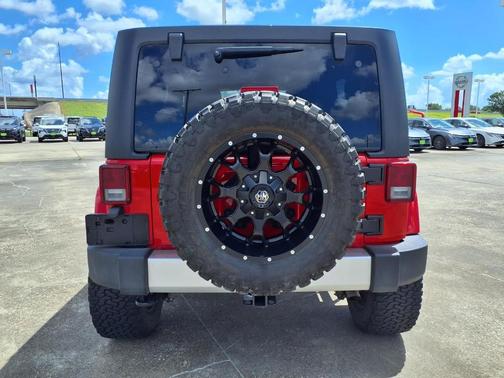 Red 2015 Jeep Wrangler Unlimited Sahara