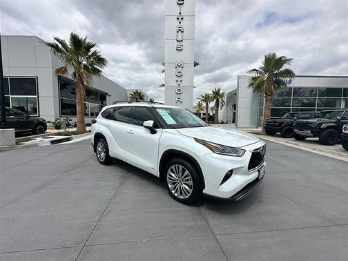 Red 2022 Toyota Highlander Hybrid Platinum