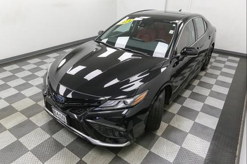 Midnight Black Metallic 2024 Toyota Camry Hybrid SE