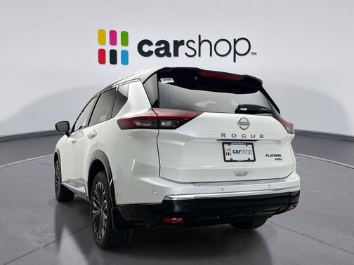 Everest White Pearl/Super Black 2025 Nissan Rogue Platinum