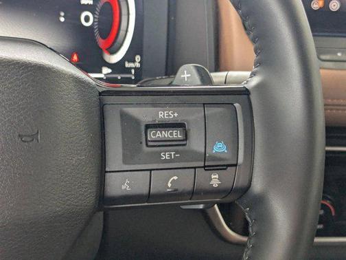 Everest White Pearl/Super Black 2025 Nissan Rogue Platinum