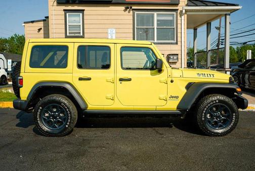 Yellow 2023 Jeep Wrangler 4xe Willys