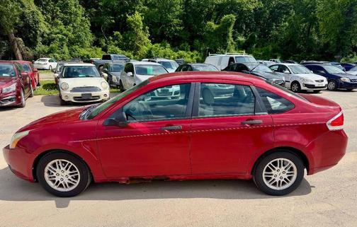 Red 2010 Ford Focus SE