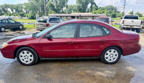 Red 2002 Ford Taurus LX 4dr Sedan